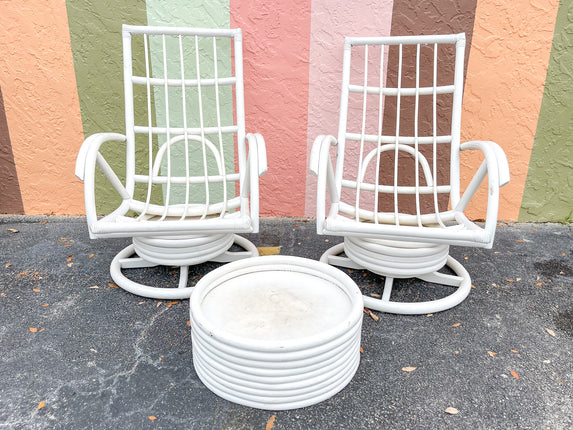 Pair of Rattan Swivel Chairs and Ottoman