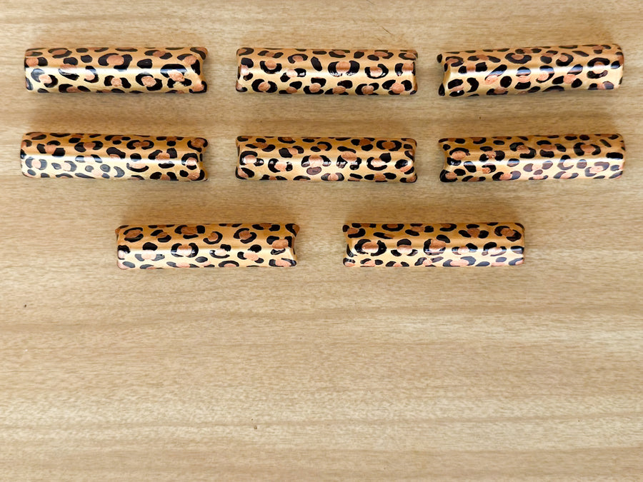 Set of Eight Hand Painted Cheetah Napkin Rings and Knife Rests