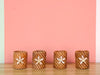 Set of Four Daisy Shell and Rattan Napkin Rings
