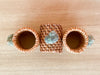 Set of Four Emerald Shell and Rattan Napkin Rings