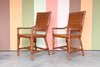 Pair of Island Chic Leather and Rattan Arm Chairs
