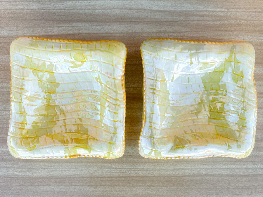 Stack of Pink and Yellow Ceramic Pillows