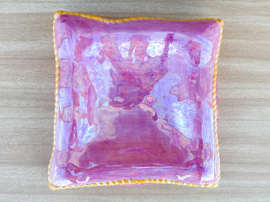 Stack of Pink and Yellow Ceramic Pillows