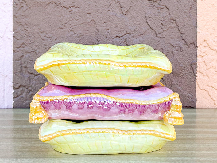 Stack of Pink and Yellow Ceramic Pillows