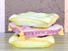 Stack of Pink and Yellow Ceramic Pillows