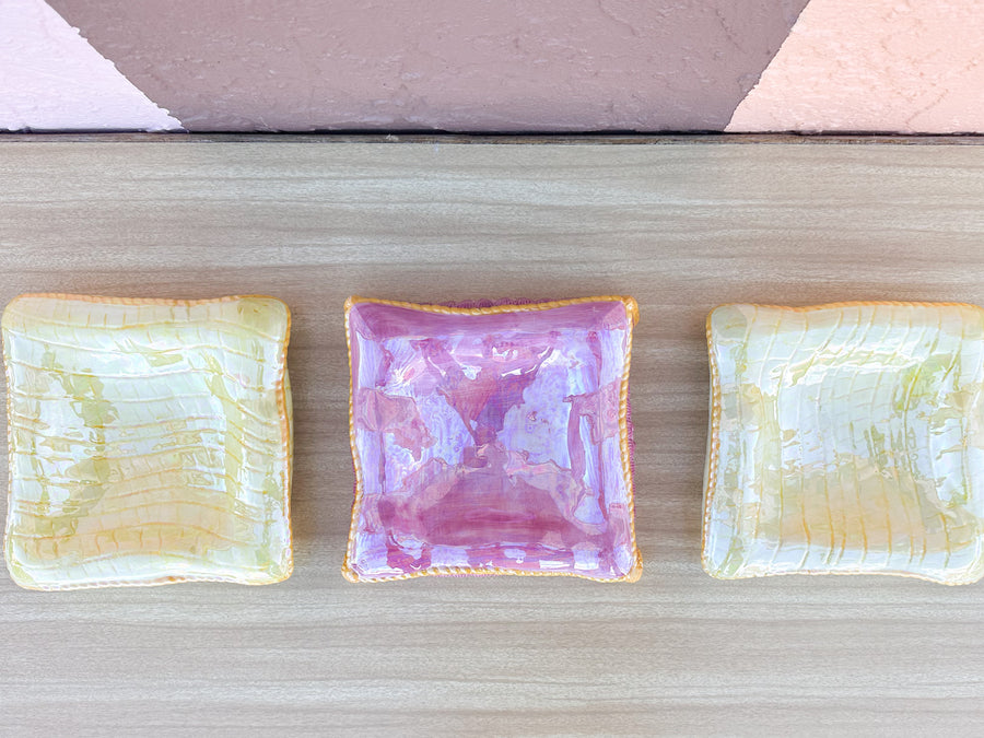 Stack of Pink and Yellow Ceramic Pillows
