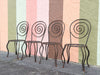 Set of Four Whimsical Circle Back Wrought Iron Chairs