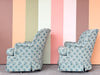 Pair of Shell Motif Upholstered Swivel Chairs