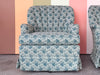 Pair of Shell Motif Upholstered Swivel Chairs