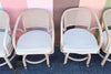 Set of Six Ficks Reed Rattan and Cane Barrel Chairs on Casters