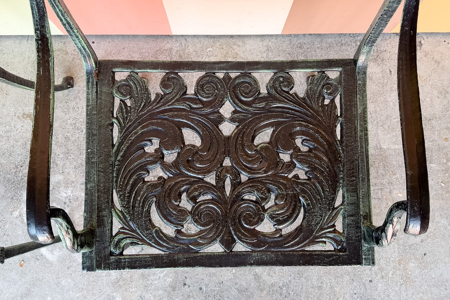 Set of Four Shell Motif Cast Iron Chairs