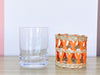 Set of Eleven Orange Raffia Glassware