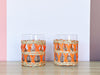 Set of Eleven Orange Raffia Glassware