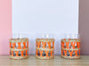 Set of Eleven Orange Raffia Glassware