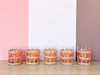 Set of Eleven Orange Raffia Glassware