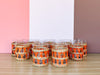 Set of Eleven Orange Raffia Glassware