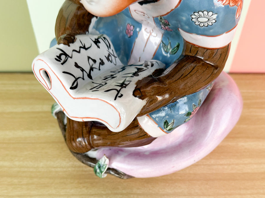 Porcelain Reading Monkey Figurine