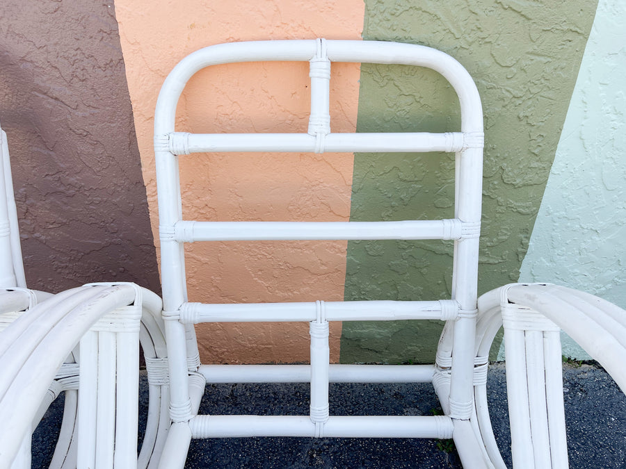 Pair of White Rattan Pretzel Chairs and Ottomans