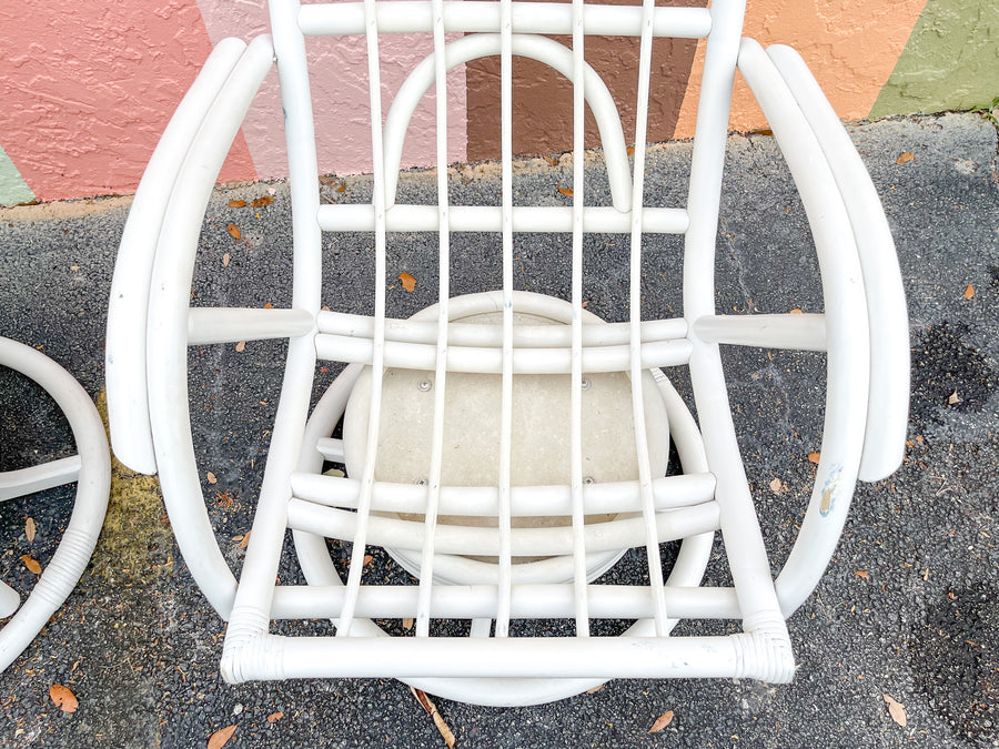 Pair of Rattan Swivel Chairs and Ottoman