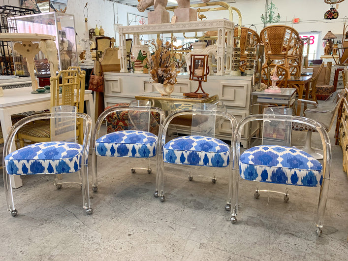 Set of Four Lucite Chairs on Casters