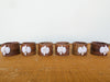 Set of Six Rattan Placemats and Shell Napkin Rings