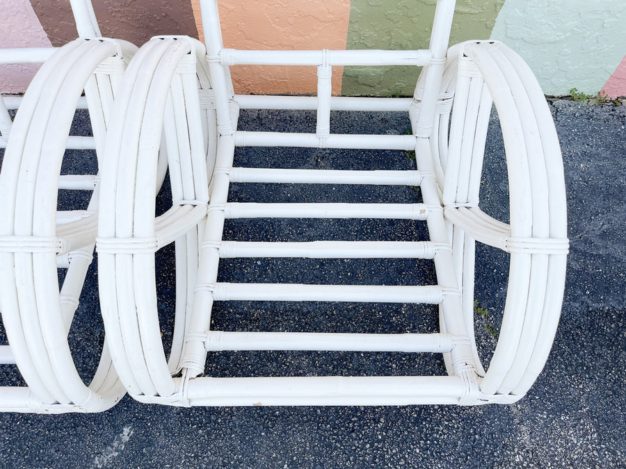 Pair of White Rattan Pretzel Chairs and Ottomans