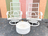 Pair of Rattan Swivel Chairs and Ottoman